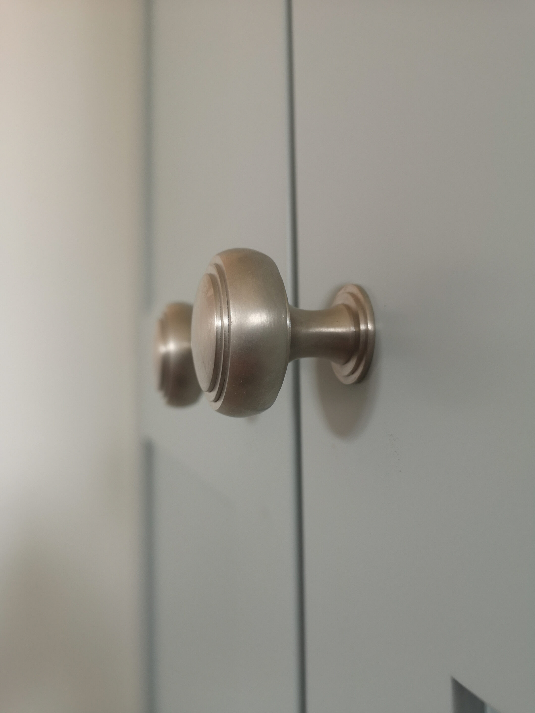 Close up of the beautiful Armac Martin Brushed Nickel door knobs on the double wardrobe with doors.