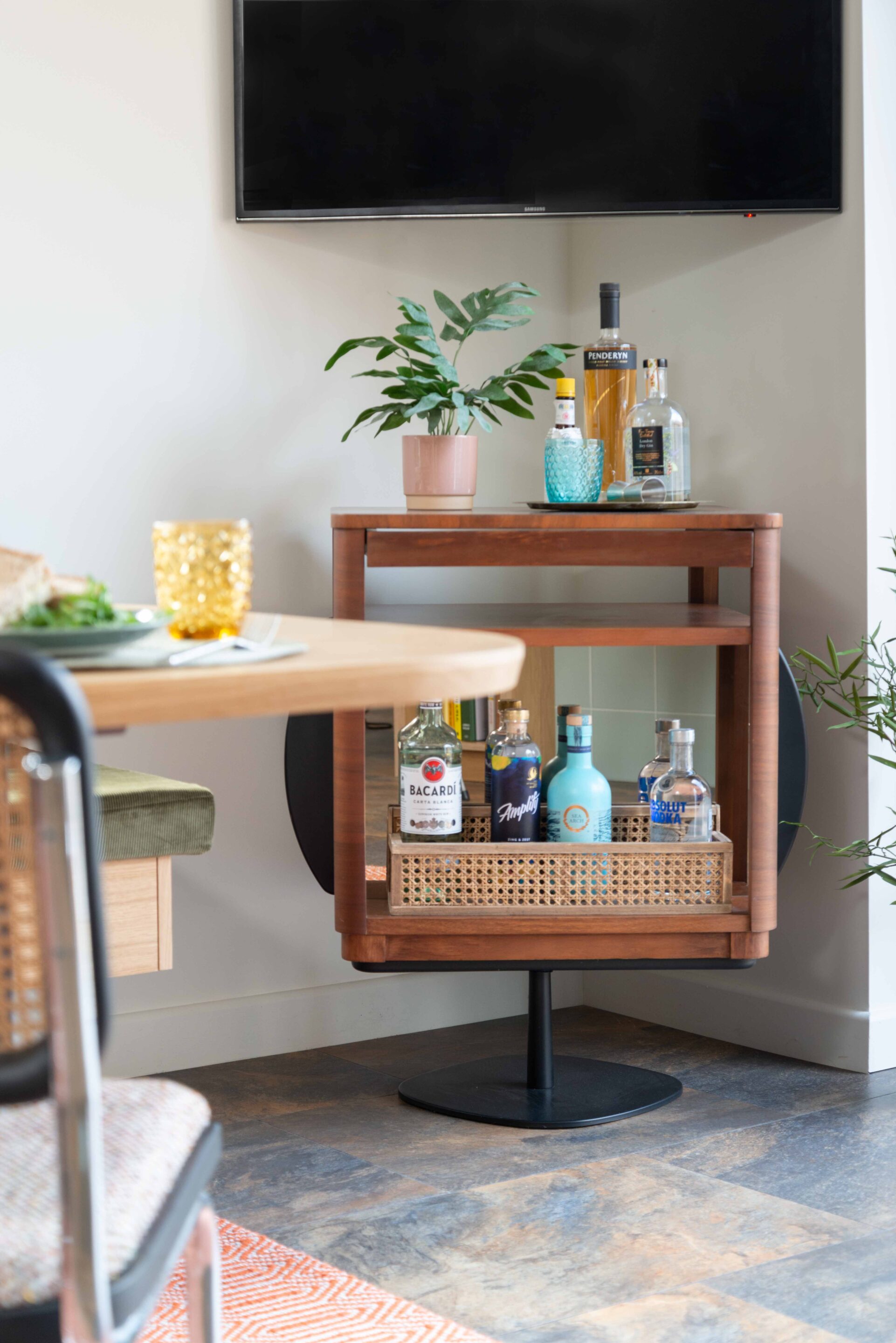 A custom base cocktail cabinet upcycled from a mid-century rotating unit