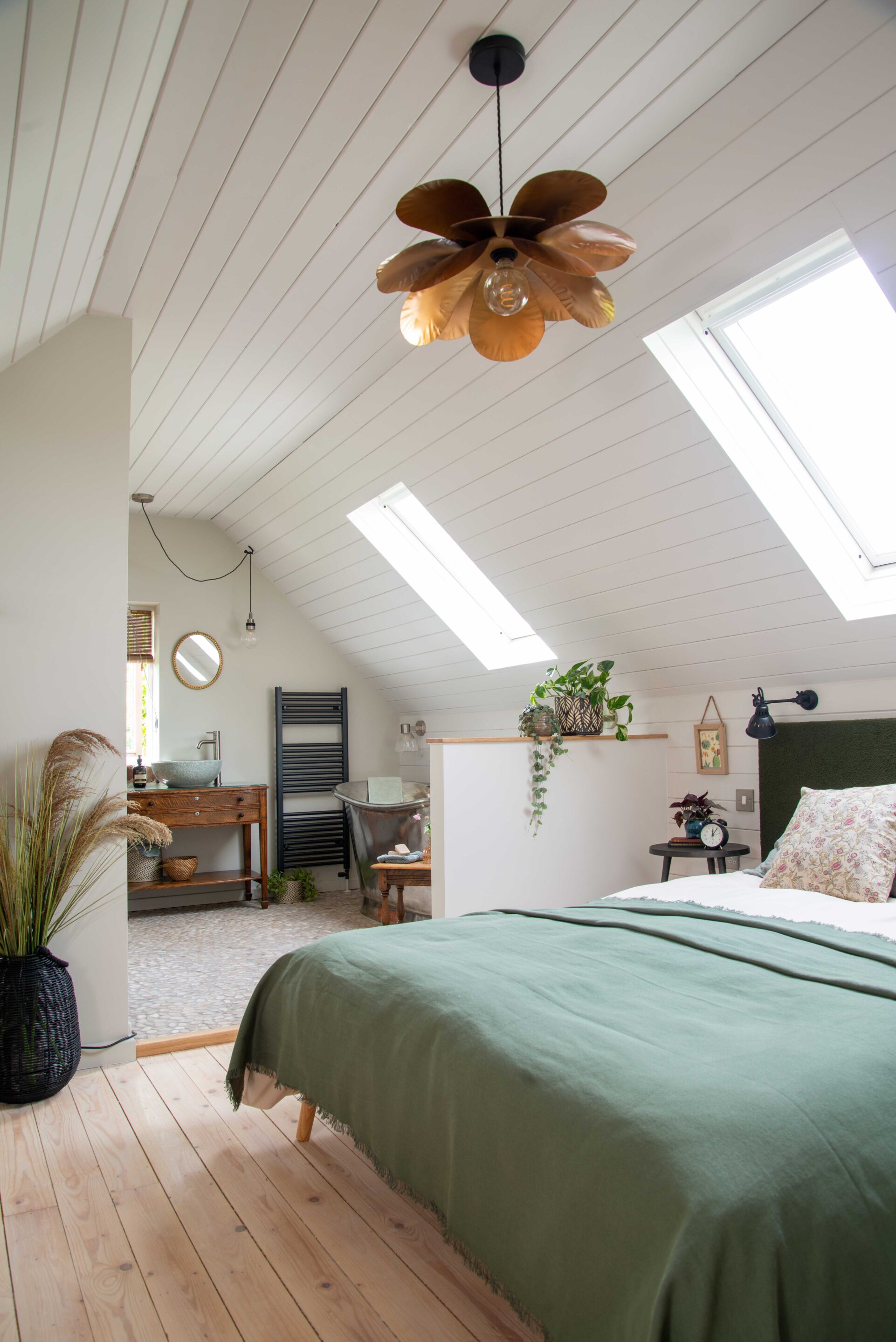 A view into the open plan bedroom and bathroom of the Loft Studio Conversion.