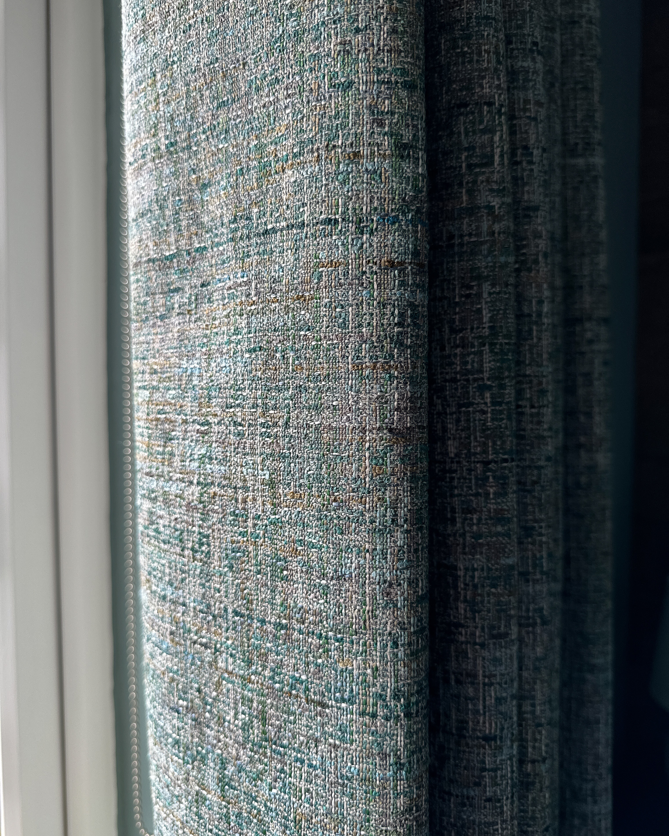 Close up of textured curtain fabric, which is Studio G Cetara in Kingsfisher.