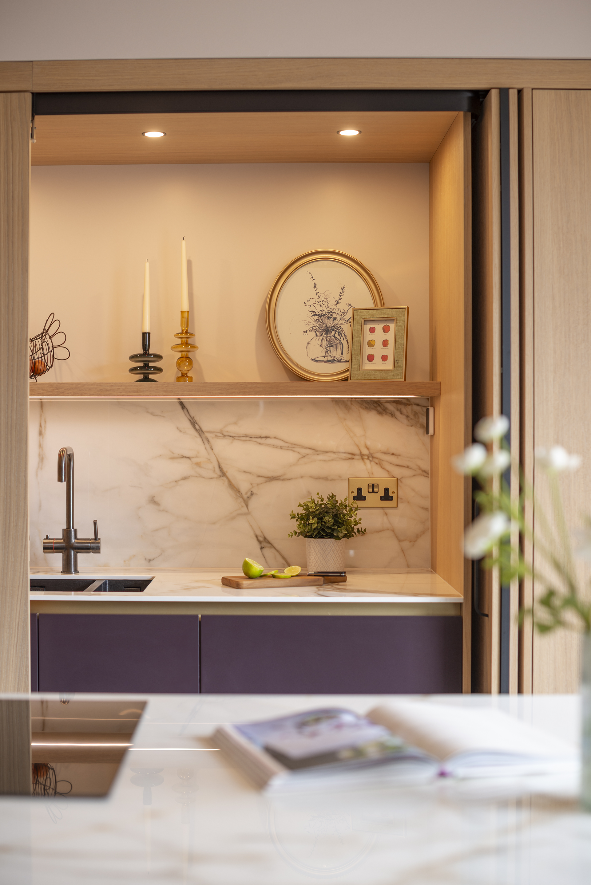 A close up of the beautiful calcutta marble effect ceramic worktop and splashback.