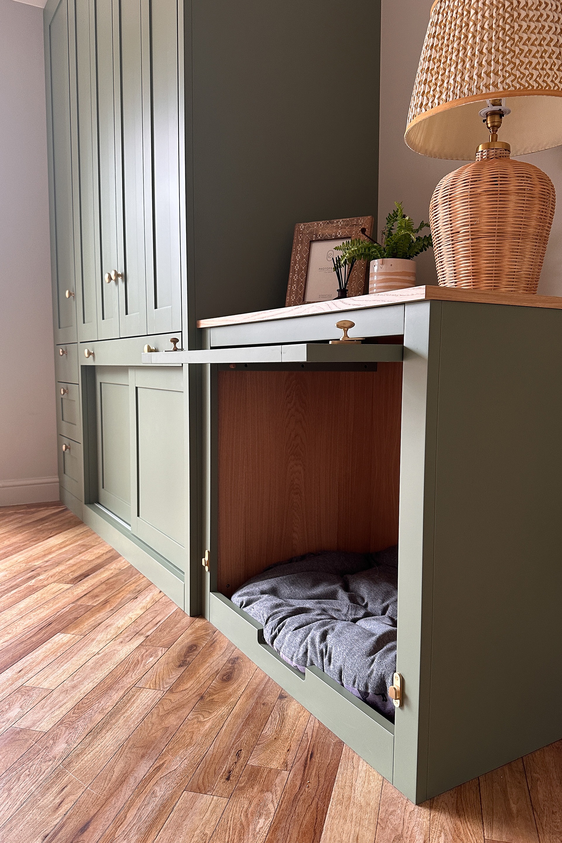 a picture of a bespoke dog bed with pull up door open. the top can be used as a sideboard for a lamp or decorative items