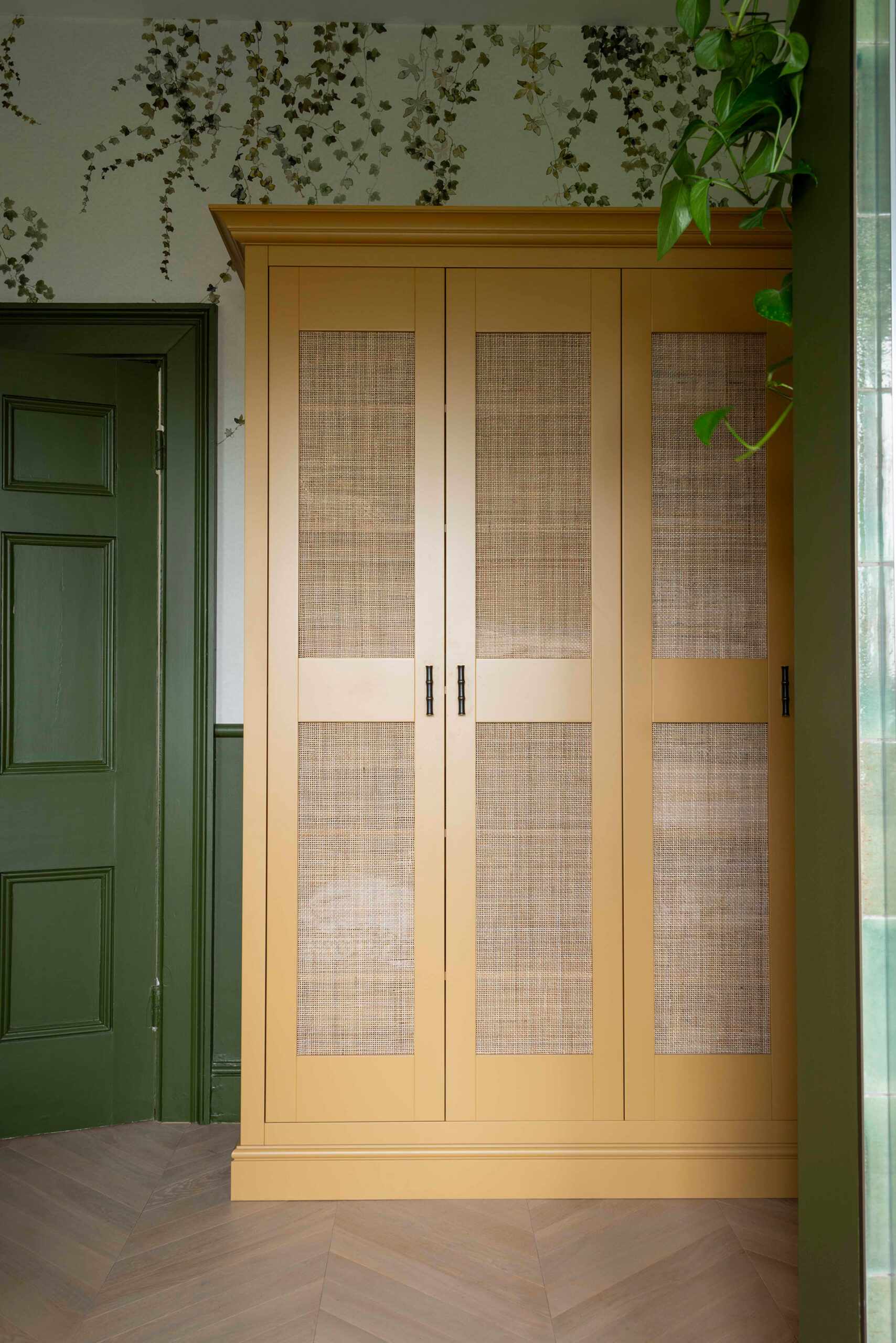 Handmade bespoke linen cupboard painted in Little Greene Bombolone.