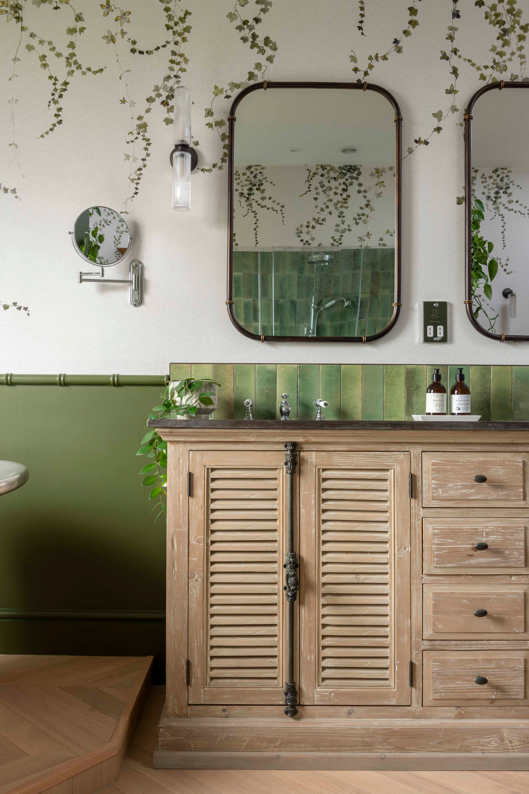 A beautiful vanity unit with louvered doors, rustic details and marble top.