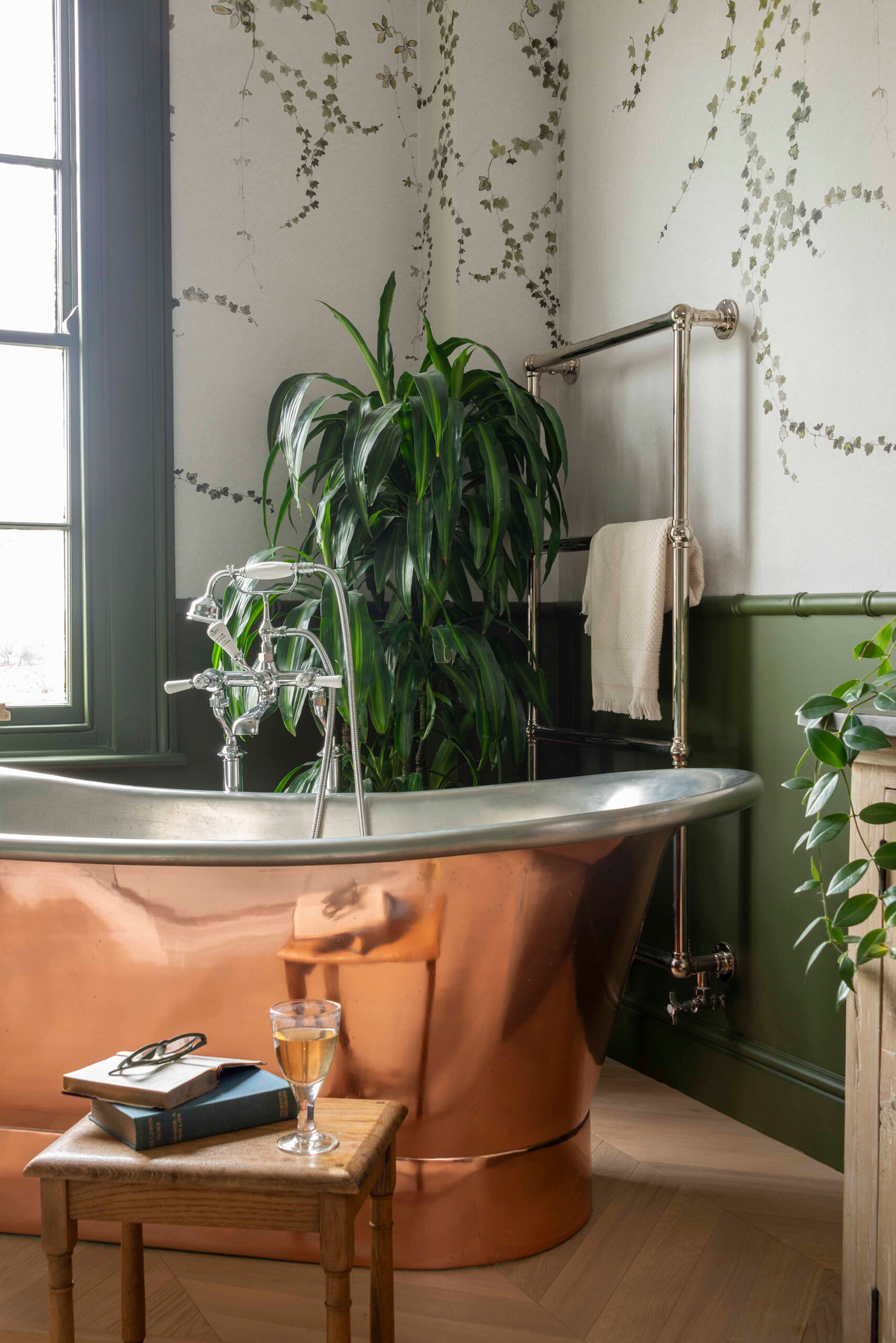 A copper bath ready for relaxing with a glass of wine a good book.