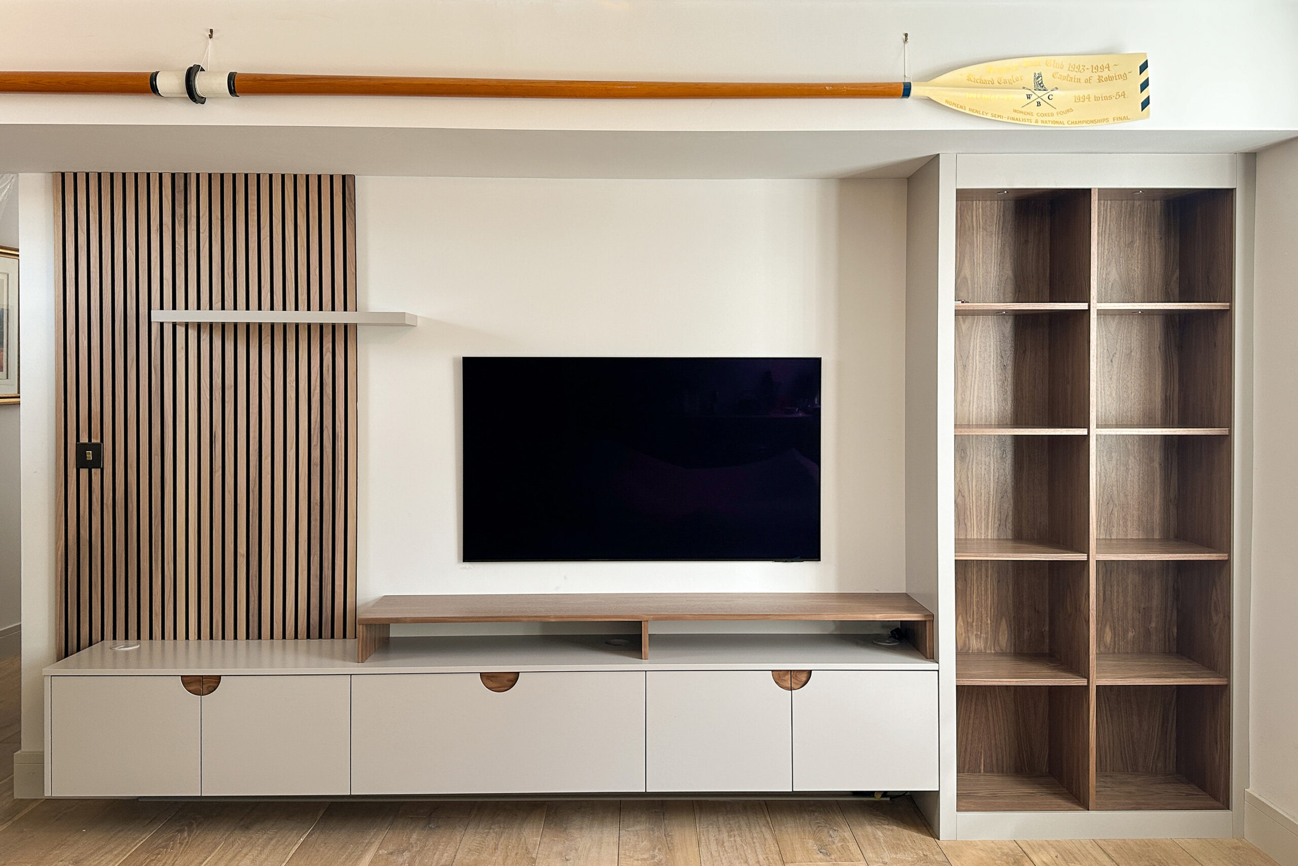 Modern media unit with slat paneling
