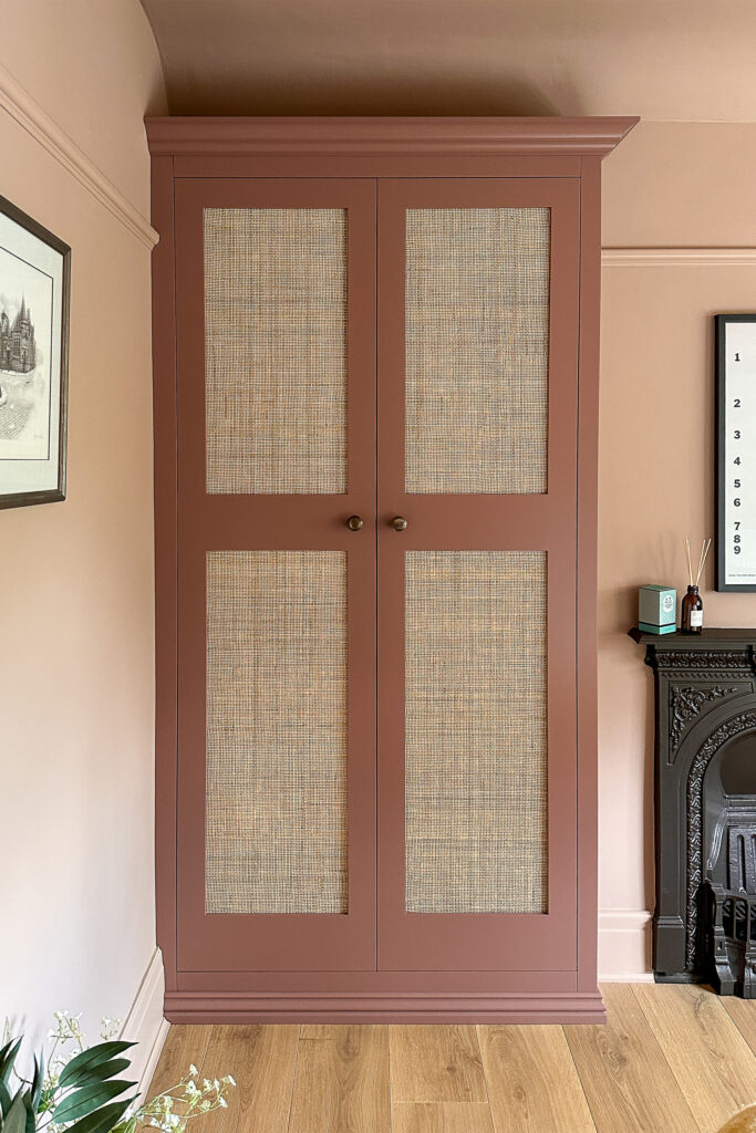 A bespoke wardrobe with Rattan Doors painted in Little Greene