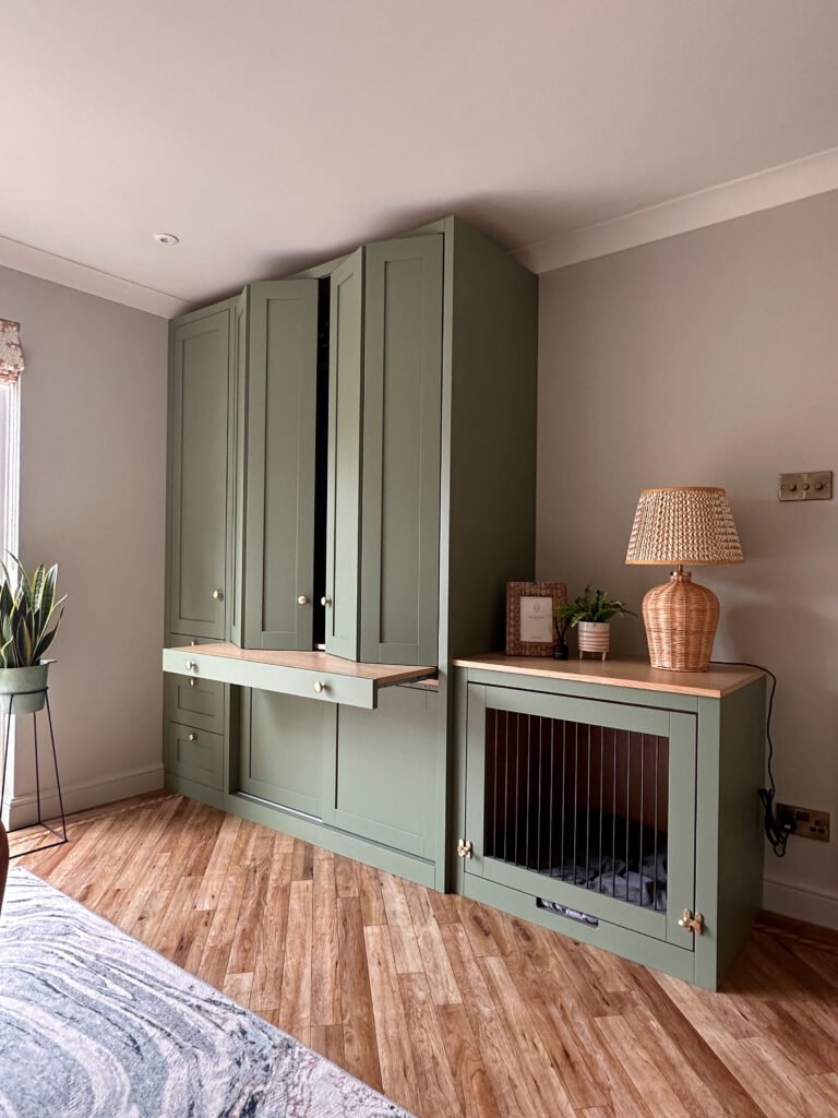 A bespoke home office, with bi-folding doors to hide the workspace and a pull out desk.