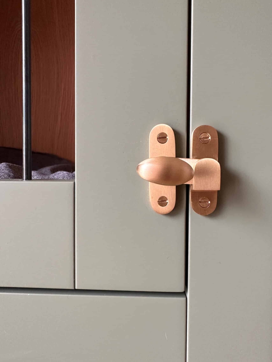 A custom dog crate integrated into a bespoke boot room