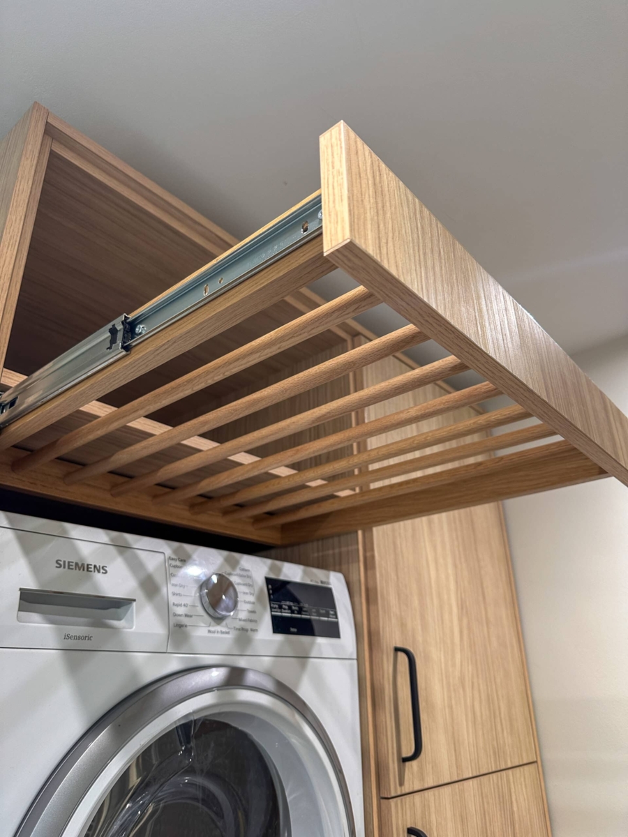 A bespoke utility room pull out drying rack